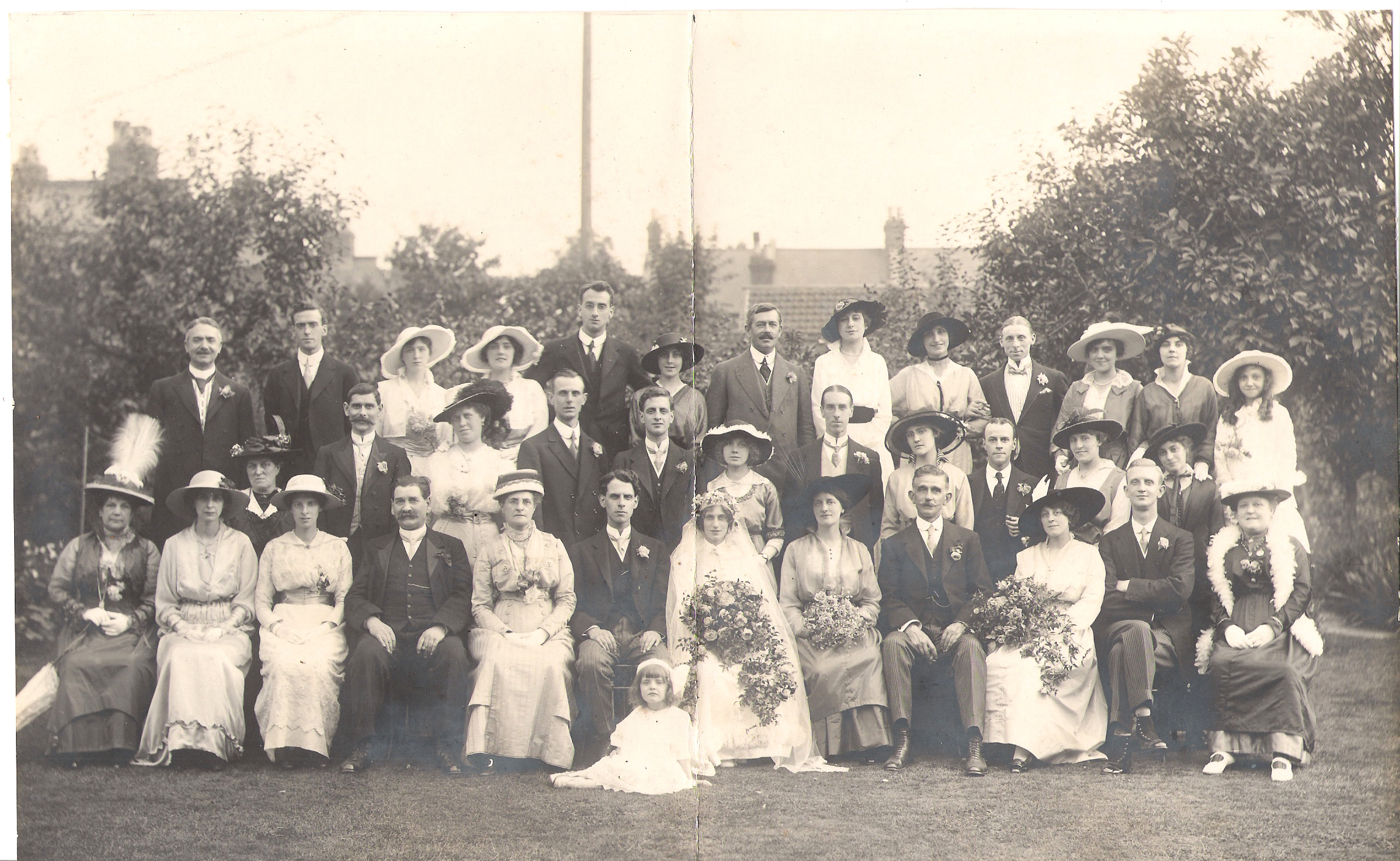 Wedding of Charles Howard SANDELL, 28th August 1915. Front row left to right: u/k, Gertrude SANDELL, Ida MALCOLM, Charles Joseph SANDELL, Edith Emma SANDELL, Charles SANDELL, Nellie May RENVOIZE, Mr and Mrs RENVOIZE, 2nd row left to right, William MALCOLM, 4th from left, Reginald Pagett SANDELL, back row, 2nd left, William TAYLOR, who married Gertrude SANDELL, miss two then Donald and Edith BEARMAN